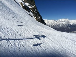 Second view from the chairlift showing the same open slope